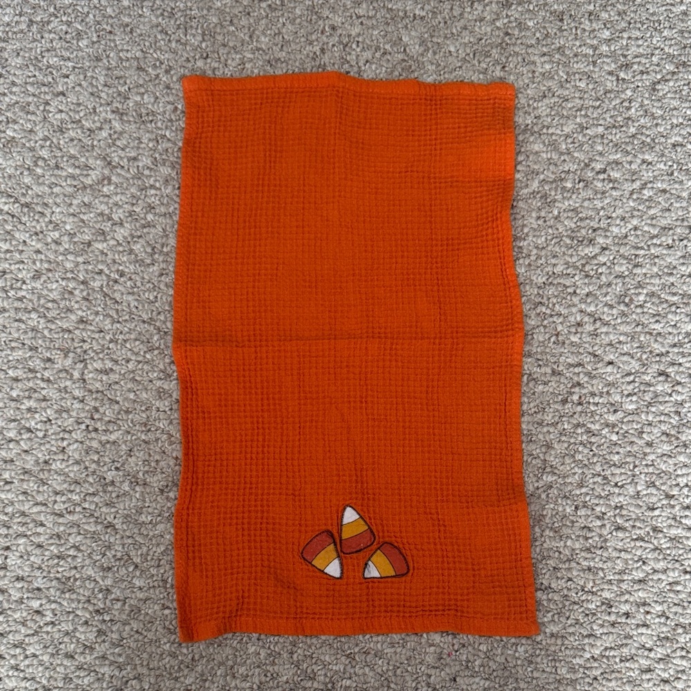 Orange hand towel with Candy Corn Design